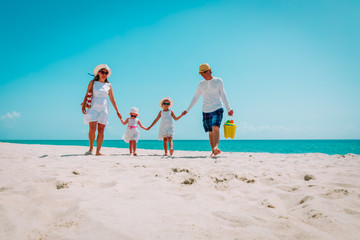 happy family with kids walk on beach