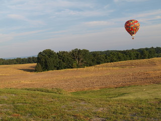 Hot Air Balloon Aloft Over Farm Fields