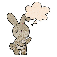 cute cartoon rabbit and thought bubble in grunge texture pattern style