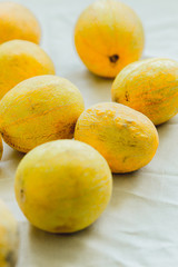 A group of bright orange melon berries.