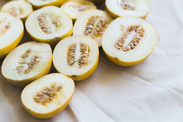 A group of brightly lit melon halves.