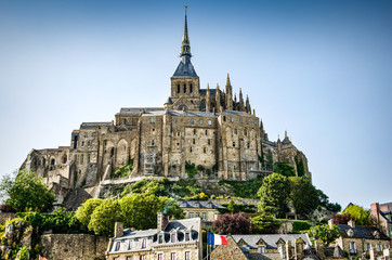 Obraz premium Mont Saint Michel, France - June 28, 2012. Famous historic cathedral at low tide 