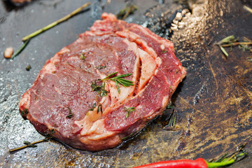Cooking beef steak on rib-in bone closeup