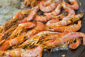 cooking shrimps in boiling oil closeup