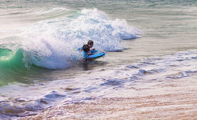 URF IN THE WAVES OF THE BEACHES OF CADIZ IN SPAIN