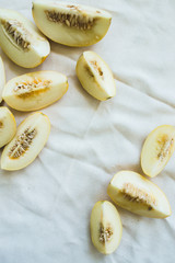 A group of brightly lit melon slices.