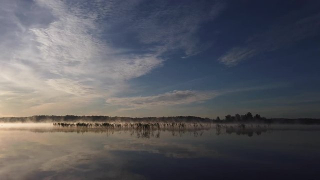 Boat ride on a lake during sunrise, point of view