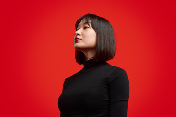 Stylish Asian woman looking at future