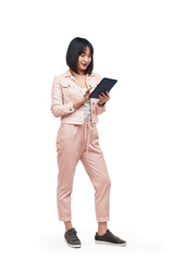 Asian lady browsing tablet