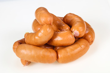 Tasty meat sausages over white background