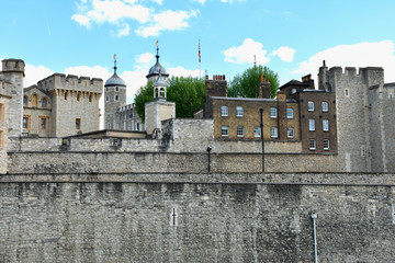 The famous White Tower and the Tower of London from South Bank across the River Thames. Popular historical tourist attraction on a summer day.