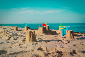 Sand castle on beach vacation and toys