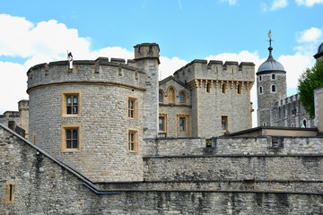 The famous White Tower and the Tower of London from South Bank across the River Thames. Popular historical tourist attraction on a summer day.