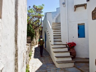Walking  Near a Whitewashed House and Stairway in Tinos, Greece