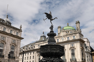 Fototapeta premium Shaftesbury Memorial Fountain toped by statue of winged Anteros in Piccadilly Circus with The Quadrant on Regent street London England