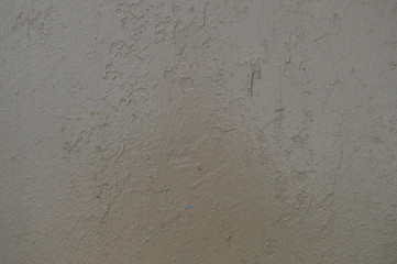 Texture of iron metal painted gray peeling paint of old battered scratched cracked ancient rusty metal sheet wall with corrosion. The background