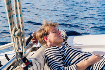 young sailor dozing while calm
