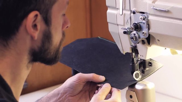 portrait of shoemaker or tailor work processes in the studio
