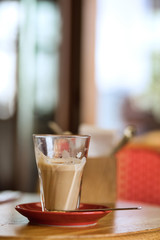 Big cup of coffee latte on a table