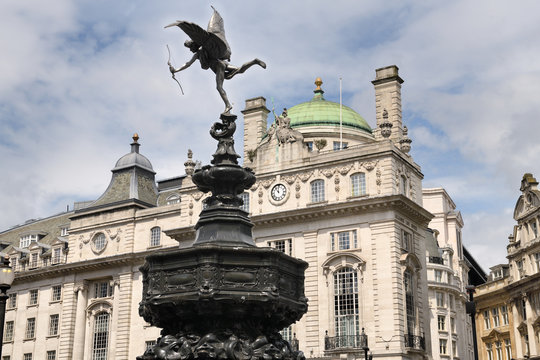 Shaftesbury Memorial Fountain with winged Anteros in Piccadilly Circus with The County Fire Office of The Quadrant on Regent street London England