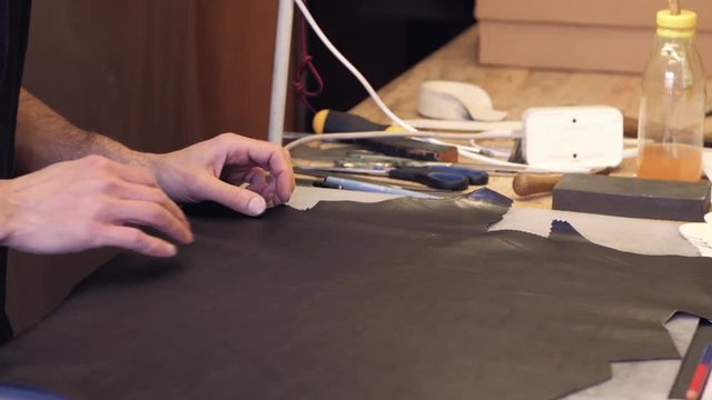 shoemaker or tailor  work processes in the studio