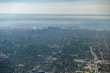 Aerial view of downtown Toronto highrise buildings from Bathurst St and Allen Expressway over Lake Ontario to St Catherines Canada