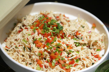 Spicy Chicken Salad on a white plate, Chinese Yunnan dish at restaurant.