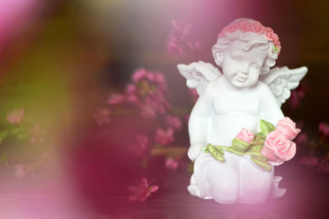 Guardian angel holding flowers