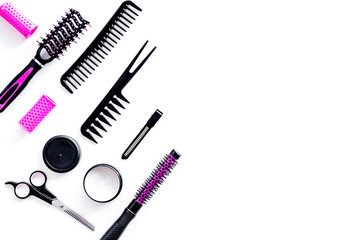 Hairdresser equipment for cutting hair and styling with combs, sciccors, brushes on white background top view copyspace
