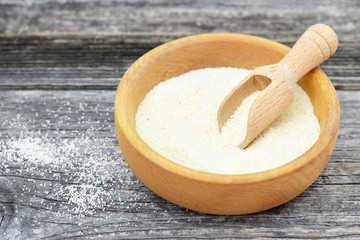 Semolina in wooden bowl