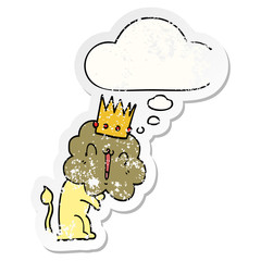 cartoon lion with crown and thought bubble as a distressed worn sticker