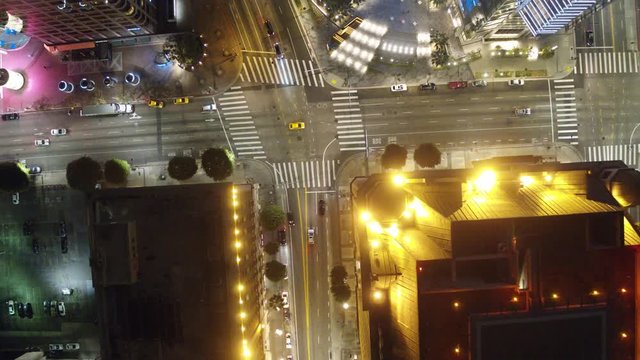 Establishing Aerial View Down Town Los Angeles Looking at traffic at Night Following car