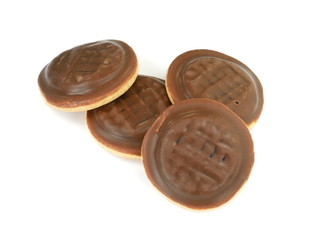 Chocolate coated biscuit cakes with the orange filling isolated over the white background.