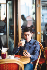 man with coffee and smartphone
