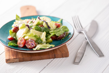 Fresh garden salad on a farmhouse table