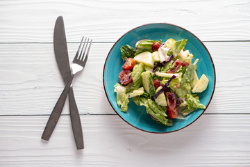 Fresh garden salad on a farmhouse table