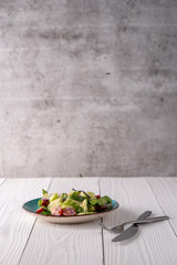 Fresh garden salad on a farmhouse table