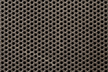 Old metal mesh covered with dust and dirt. Background and pattern