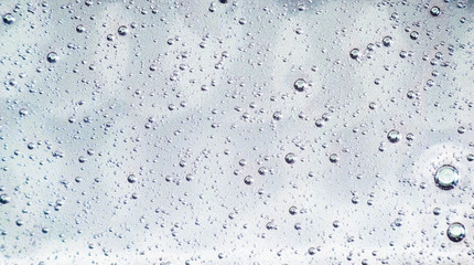 Pink and blue bubbles made of soapy cosmetics, beauty products