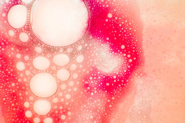 pink bubbles looking like cells through the microscpe, useful as a background for biology and...