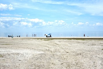 PEOPLE ON GRAND BEACH