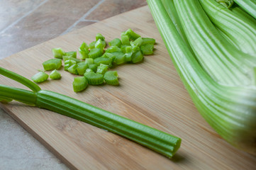 Fresh Celery on a wooden cutting board