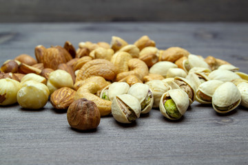 nuts almonds cashew hazelnuts scattered on a wooden table