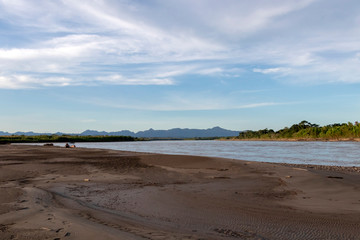 Sunset at Beni river cliffs, adventure in jungles of Madidi national park, Amazon river basin in Bolivia, South America