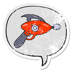 cartoon ray gun and speech bubble distressed sticker