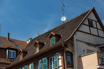 Satellite dishes on a tiled roof