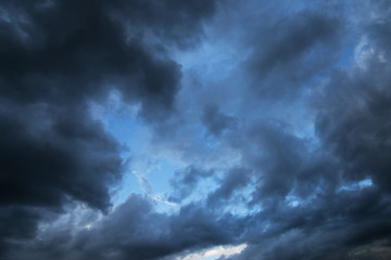 Naklejka na ściany i meble Epic Storm blue sky, dark clouds background texture