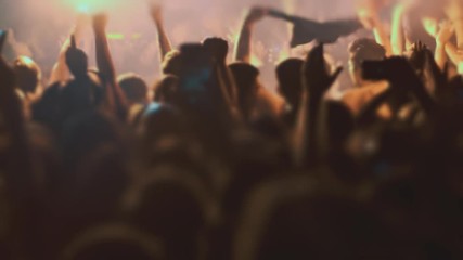 Night Rock Concert Front Row Crowd Cheering in slow motion.Epic party with enthustastic people.
