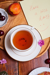 happy  morning . life style shot morning tea with  berry cake, fruits and african violet flowers