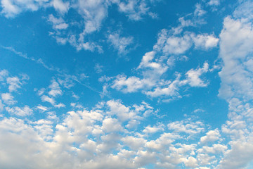 textured small clouds in the blue sky